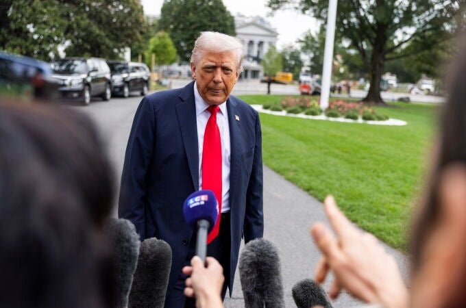 US President Trump speaks to media as he departs White House for UK