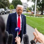 US President Trump speaks to media as he departs White House for UK