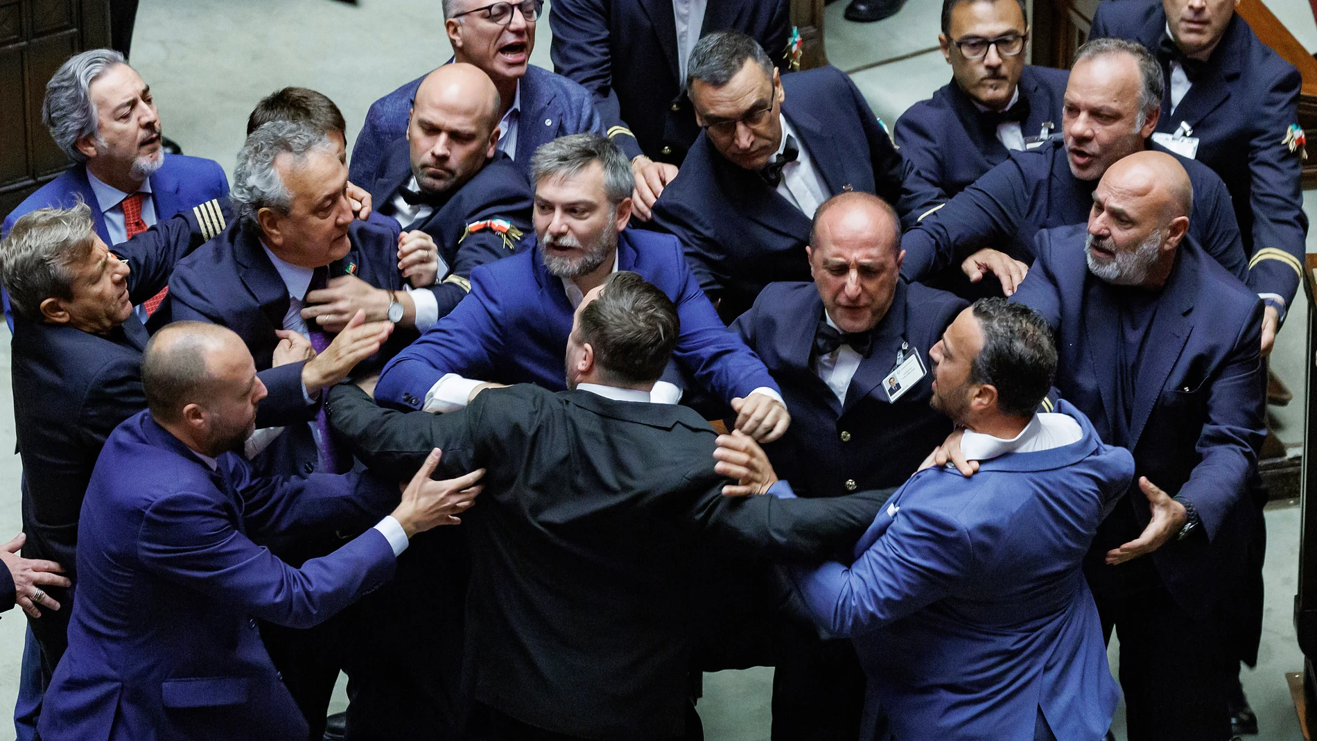 Paolo Barelli, Leonardo Donno and others argue after the final vote on the constitutional bill relating to the judiciary system and the establishment of the Disciplinary Court, in the Chamber of Deputies (the lower house of Italian Parliament), Rome, Thursday, September 18, 2025 (Roberto Monaldo/LaPresse via AP)