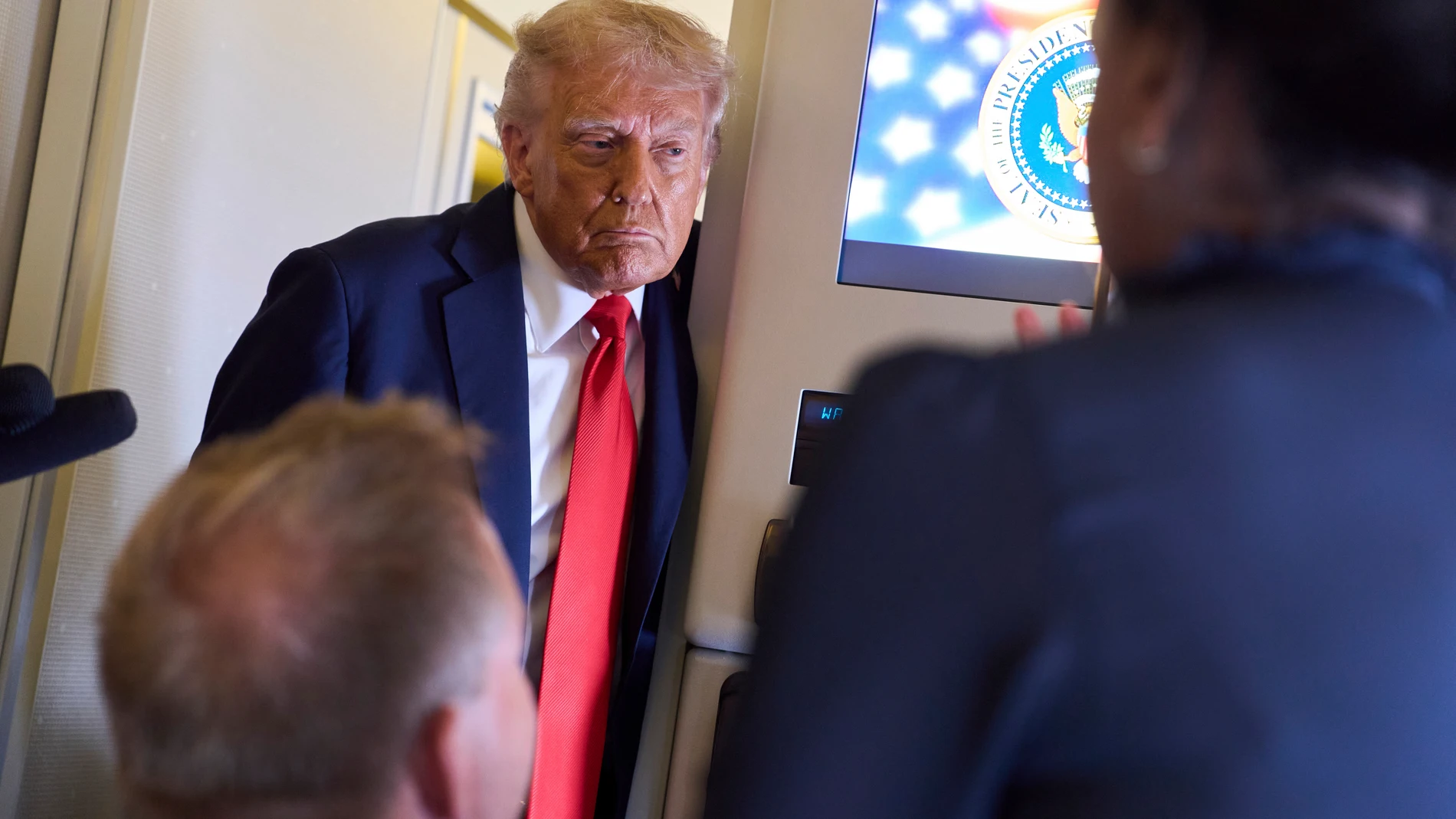 President Donald Trump speaks with reporters after departing the United Kingdom, Thursday, Sept. 18, 2025, aboard Air Force One. (AP Photo/Evan Vucci)