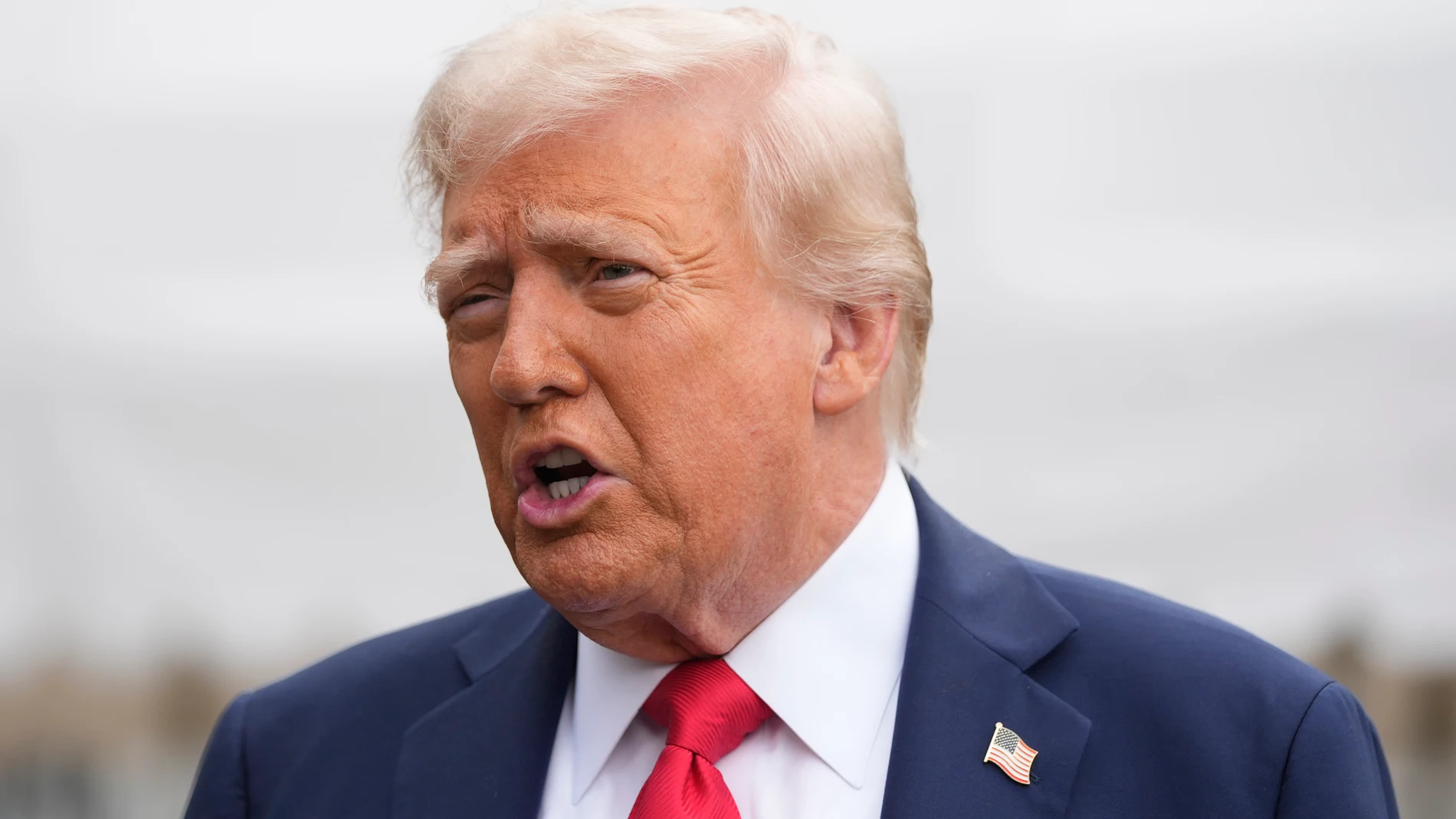 President Donald Trump speaking to members of the media on the South Lawn of the White House before he boarding Marine One en route to Joint Base Andrews, Md., Sunday, Sept. 21, 2025, in Washington. (AP Photo/Mark Schiefelbein)