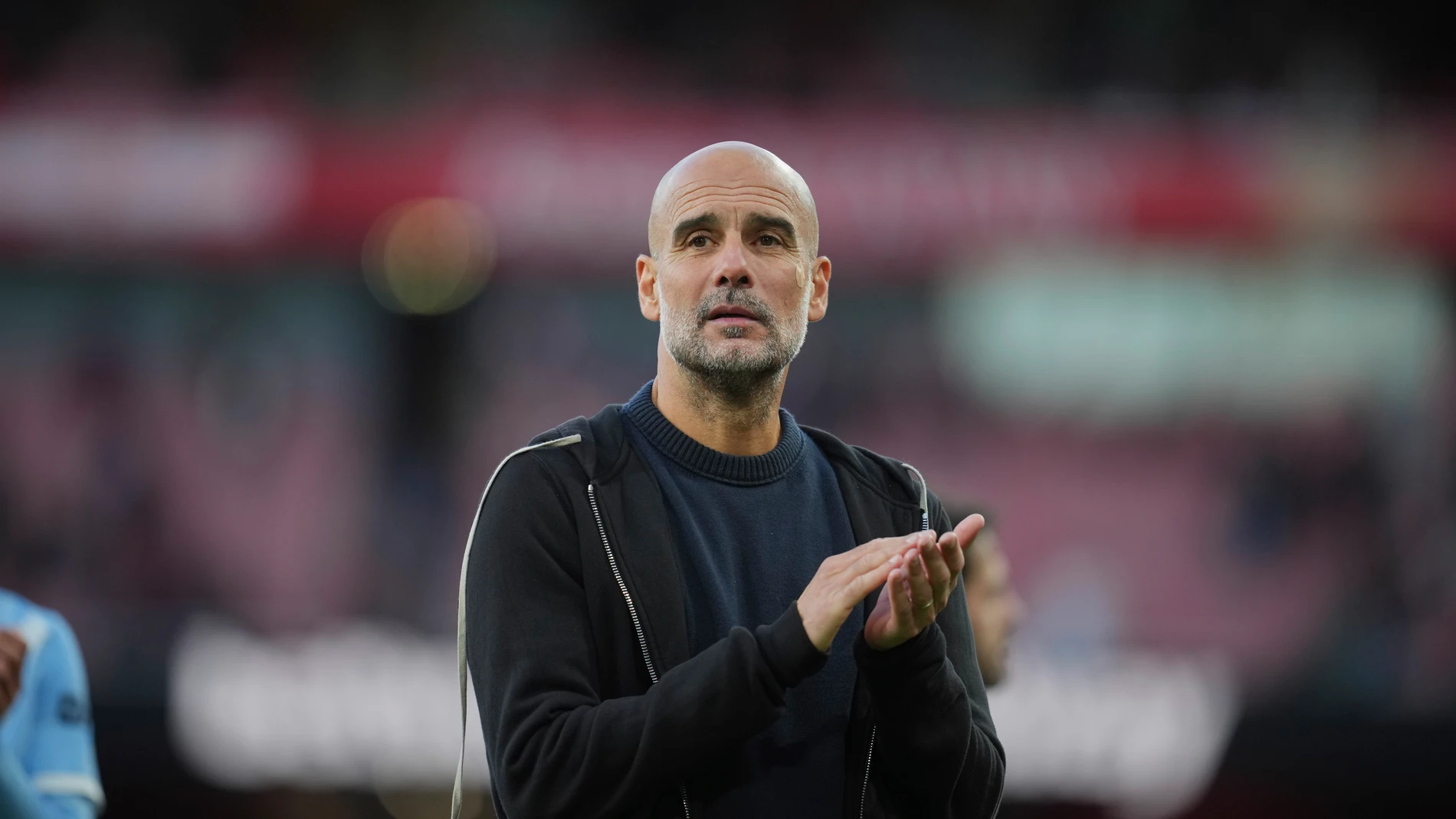 Manchester City's head coach Pep Guardiola walks off the ptich after the Premier League soccer match between Arsenal and Manchester City in London, Sunday, Sept. 21, 2025. (AP Photo/Kin Cheung)