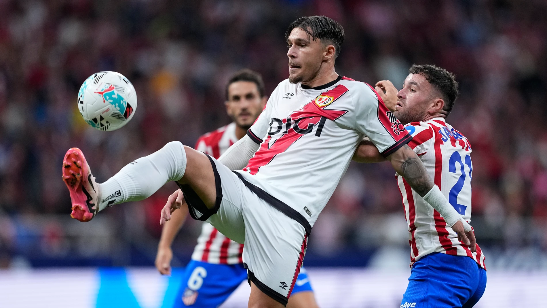 Andrei Ratiu of Rayo Vallecano and Javi Galan of Atletico de Madrid in action during the Spanish League, LaLiga EA Sports, football match played between Atletico de Madrid and Rayo Vallecano at Riyadh Air Metropolitano stadium on September 24, 2025, in Madrid, Spain. AFP7 24/09/2025 ONLY FOR USE IN SPAIN