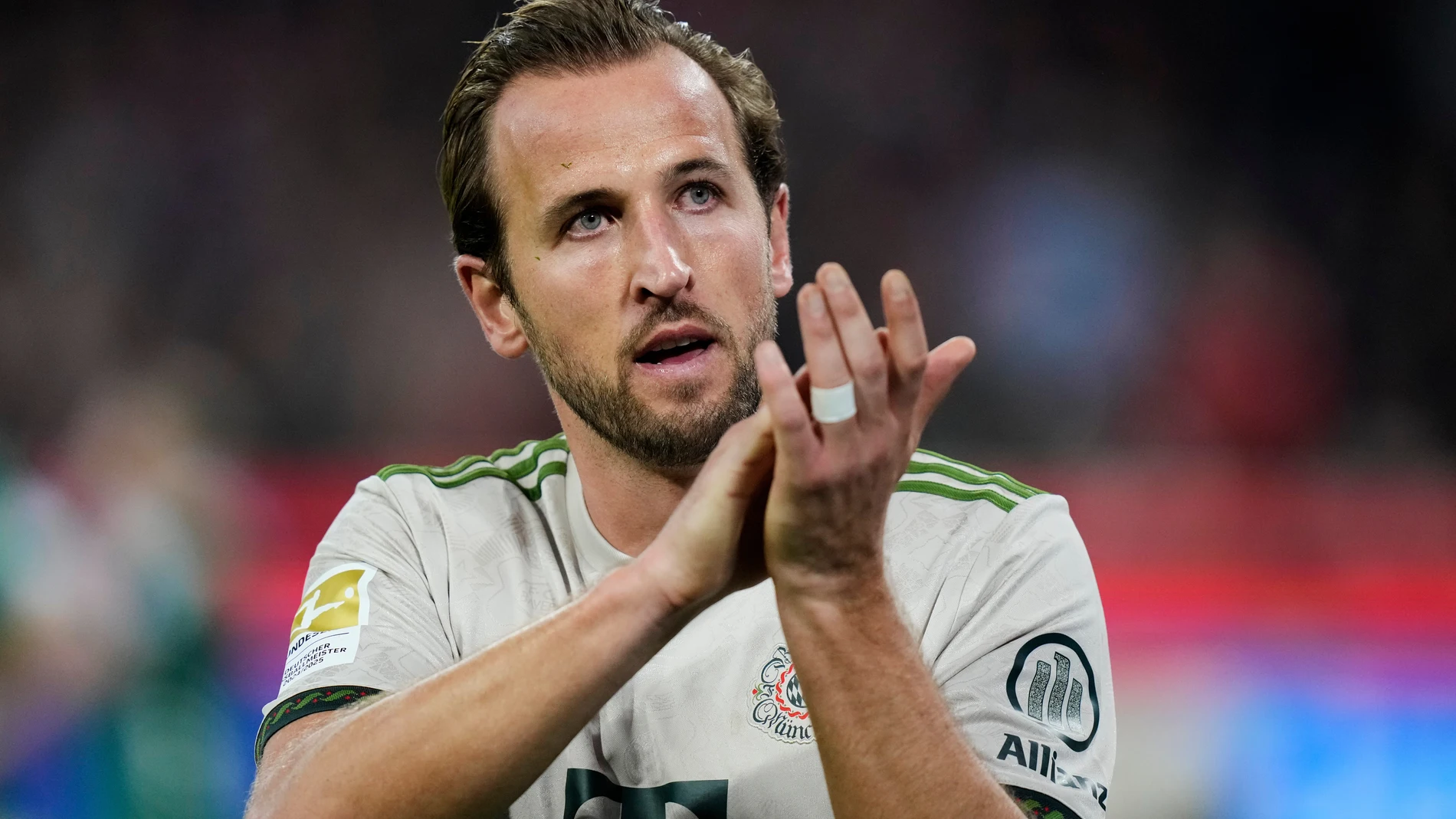 Bayern's Harry Kane applauds during the Bundesliga soccer match between Bayern Munich and Werder Bremen at the Allianz Arena in Munich, Germany, Friday, Sept. 26, 2025. (AP Photo/Matthias Schrader)