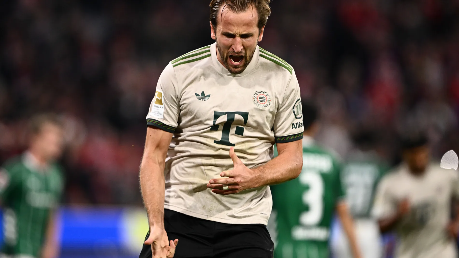 Bayern's Harry Kane celebrates scoring from the penalty spot during the Bundesliga soccer match between Bayern Munich and Werder Bremen at the Allianz Arena in Munich, Germany, Friday, Sept. 26, 2025. (Harry Langer/dpa via AP)