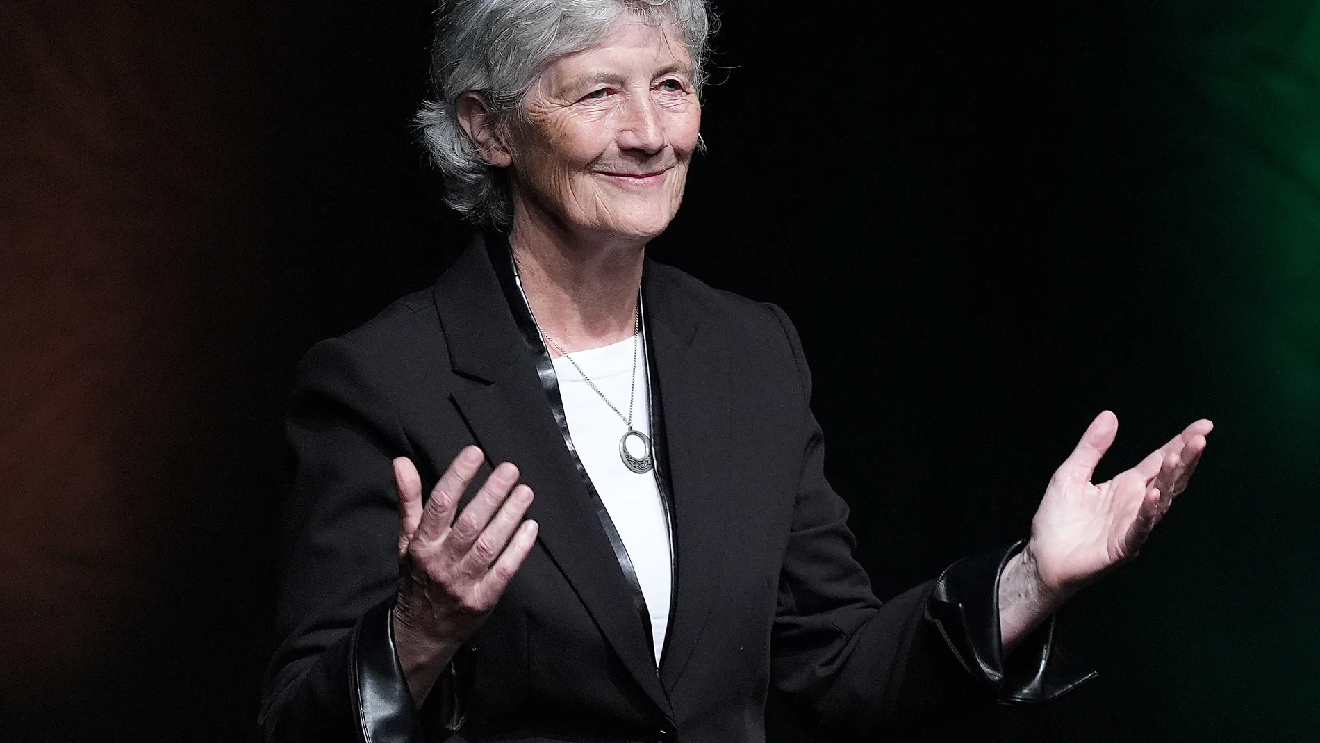 Irish Presidential candidate Catherine Connolly gestures at at the Sinn Fein Building for Unity national conference at The Helix in Dublin, Ireland, Saturday, Sept. 27, 2025. (Niall Carson/PA via AP)