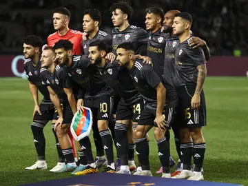 Azerbaijan Soccer Champions League Qarabag's players pose for a photo ahead of the Champions League opening phase soccer match between Qarabag and FC Copenhagen at the Tofiq Bahramov stadium in Baku, Azerbaijan, Wednesday, Oct. 1, 2025. (AP Photo)