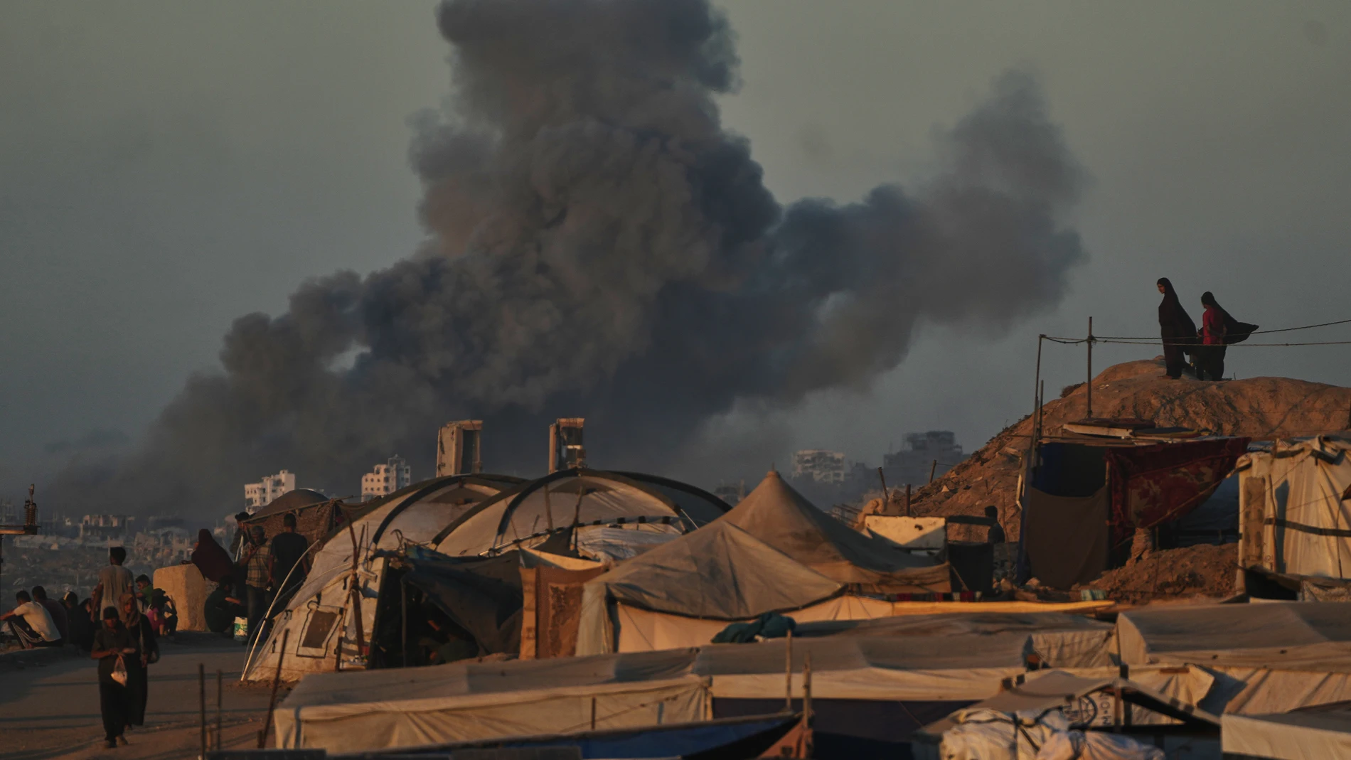 Smoke rises following an Israeli military strike in Gaza City, as seen from the central Gaza Strip, Wednesday, Oct, 1, 2025. (AP Photo/Abdel Kareem Hana)