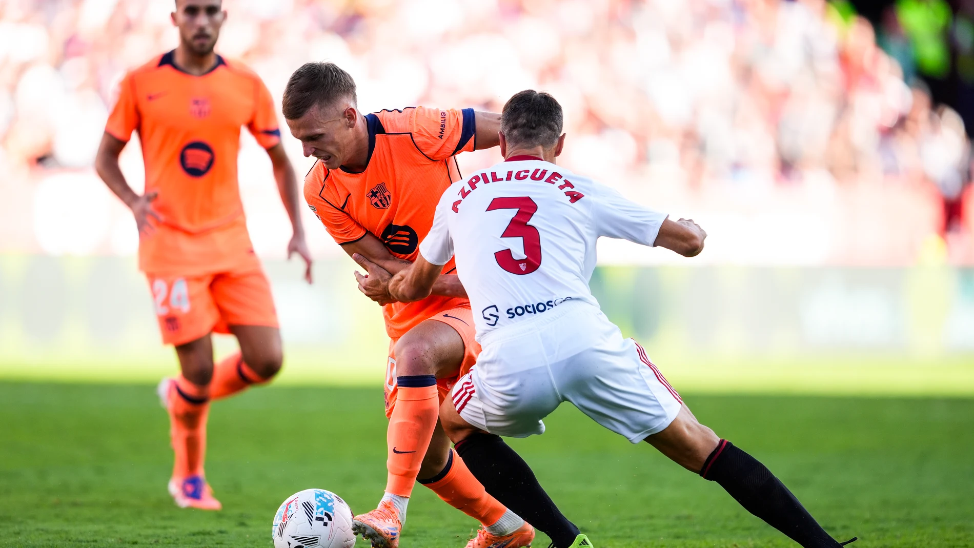 Dani Olmo of FC Barcelona and Cesar Azpilicueta of Sevilla FC in action during the Spanish league, LaLiga EA Sports, football match played between Sevilla FC and FC Barcelona at Ramon Sanchez-Pizjuan stadium on October 5, 2025, in Sevilla, Spain. AFP7 05/10/2025 ONLY FOR USE IN SPAIN