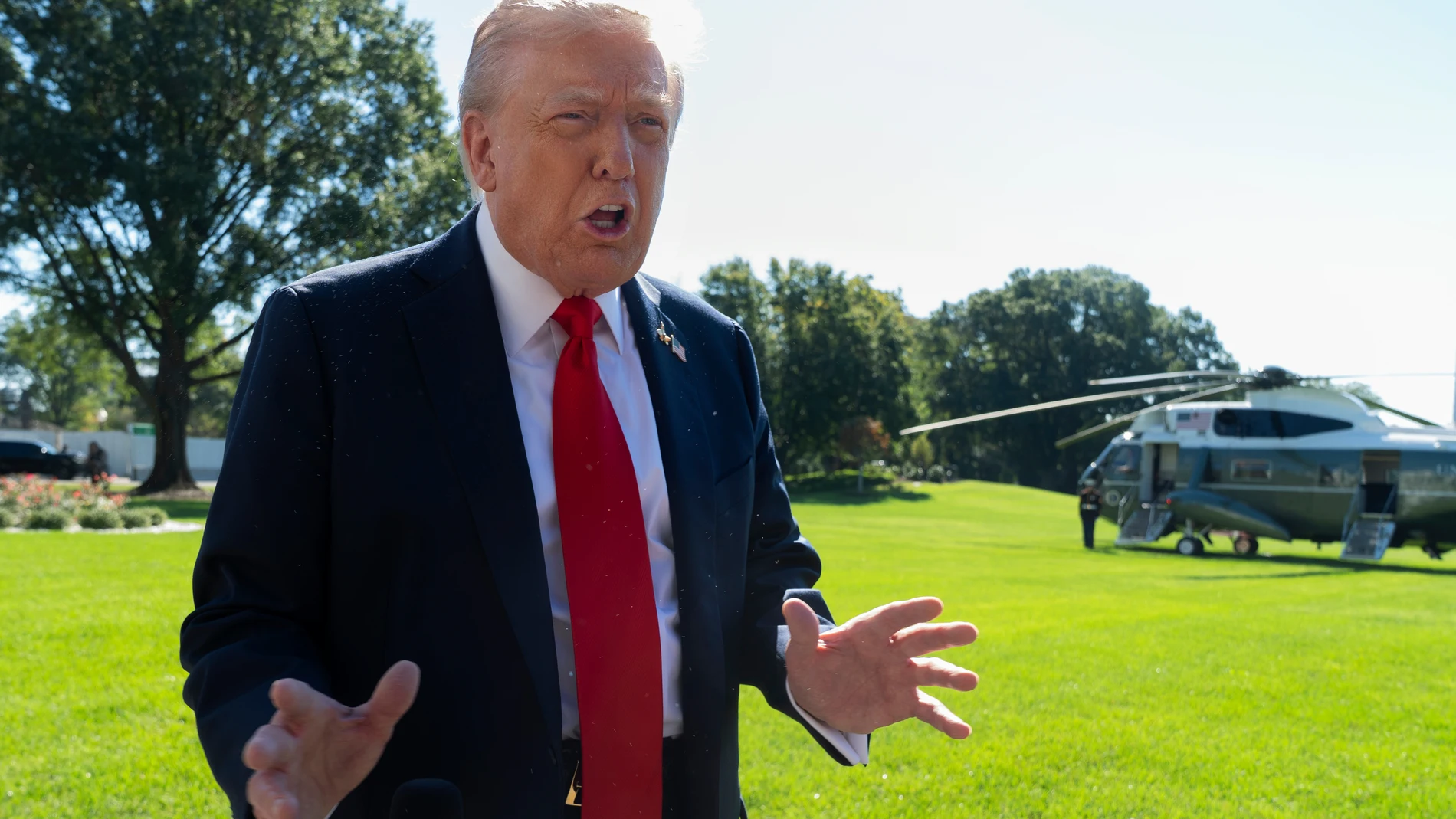 President Donald Trump speaks to reporters before departing the White House, en route Norfolk, Va., to observe a naval sea power demonstration, Sunday, Oct. 5, 2025, in Washington. (AP Photo/Manuel Balce Ceneta)