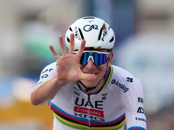 Italy Cycling Lombardia Reigning World Champion Tadej Pogacar indicates five as he celebrates winning his fifth in a row Il Lombardia, Tour of Lombardy cycling race, in Bergamo, Italy, Saturday, Oct. 11, 2025. (Gian Mattia D'Alberto/LaPresse via AP)