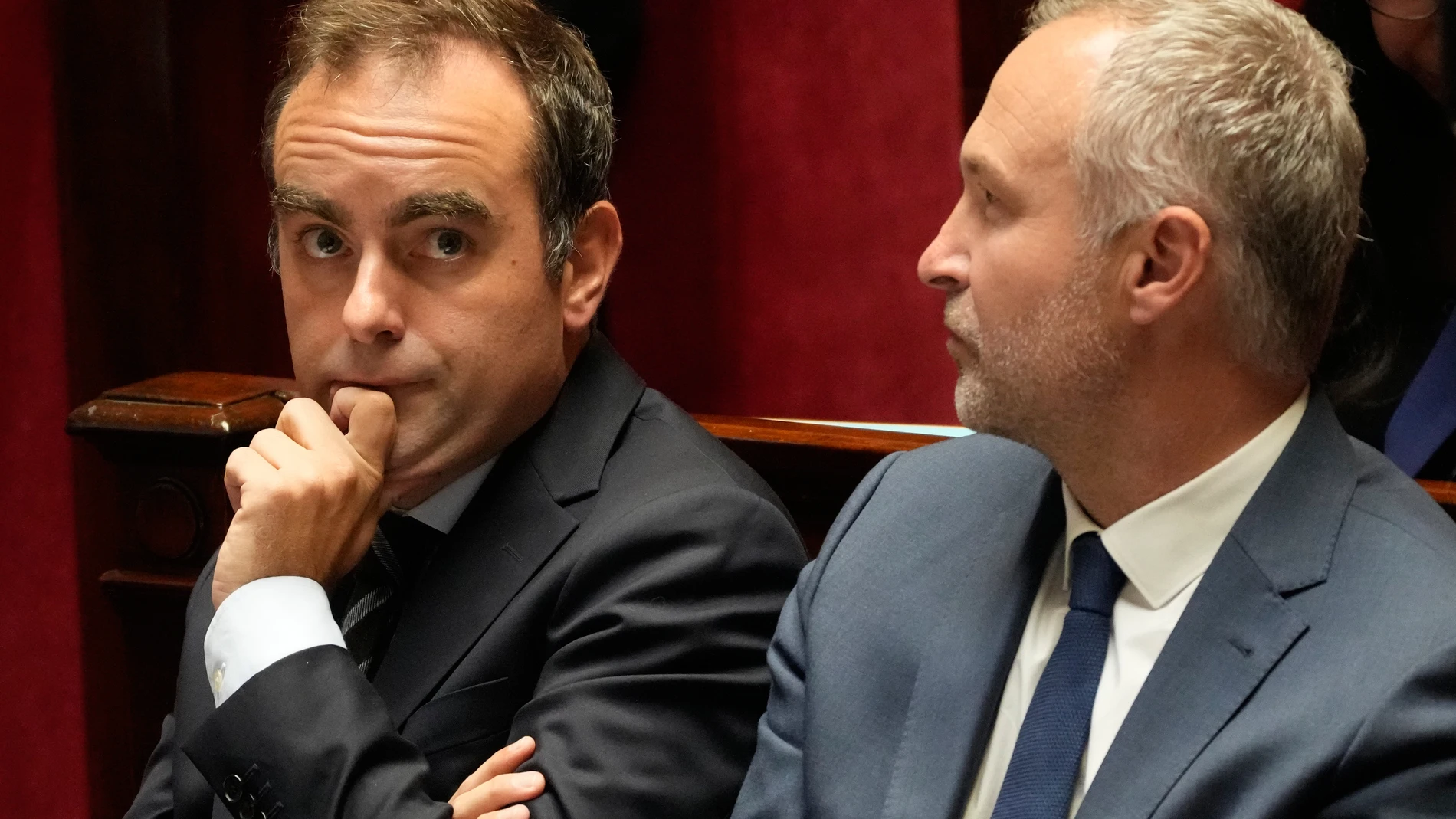 French Prime Minister Sebastien Lecornu, left, and the minister in charge of Relations with the Parliament Laurent Panifous listen during the questions and answers to the government session, Wednesday, Oct. 15, 2025 at the National Assembly in Paris. (AP Photo/Michel Euler)