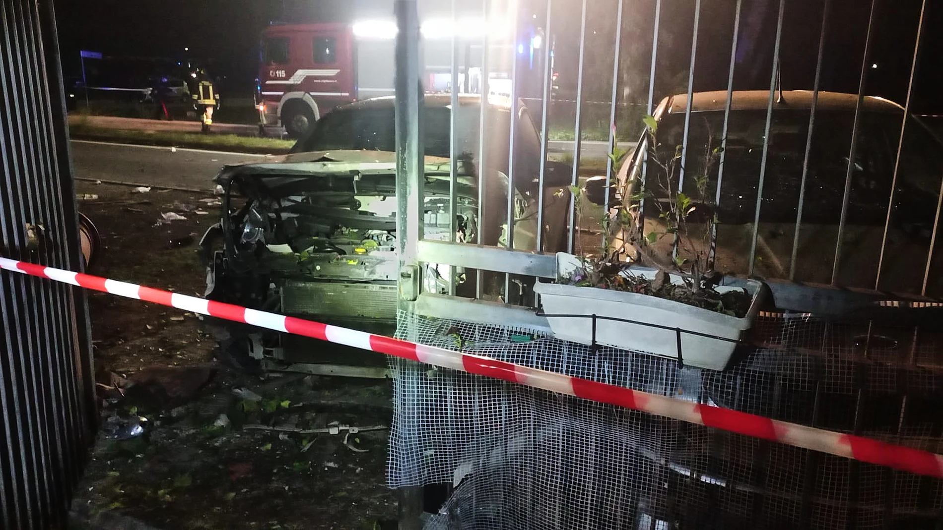 This image released by investigative journalist Sigfrido Ranucci shows his destroyed car, left, outside his home after an explosive device detonated beneath it, in Pomezia, near Rome, Italy, on Thursday, Oct. 16, 2025. (Sigfrido Ranucci via AP, HO)