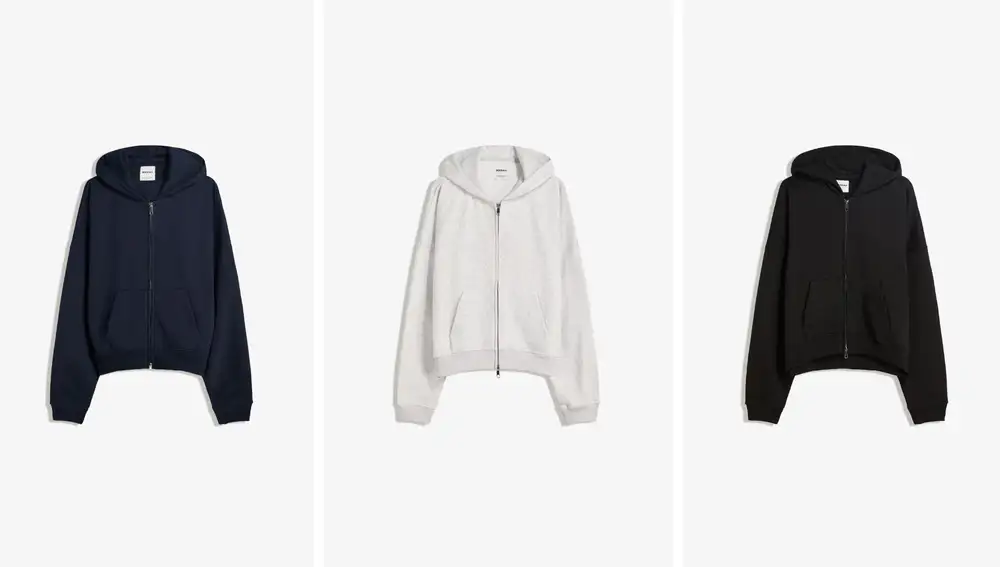 Sudadera con cremallera de Bershka (22,99€), disponible en gris, negro y azul marino.