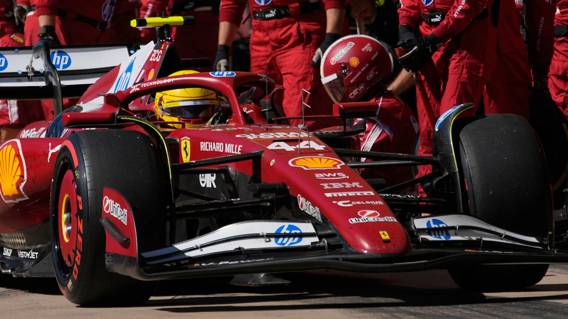 Ferrari driver Lewis Hamilton of Britain makes a pit stop during the Formula One U.S. Grand Prix auto race in Austin, Texas, Sunday, Oct. 19, 2025. (AP Photo/John Locher, Pool)