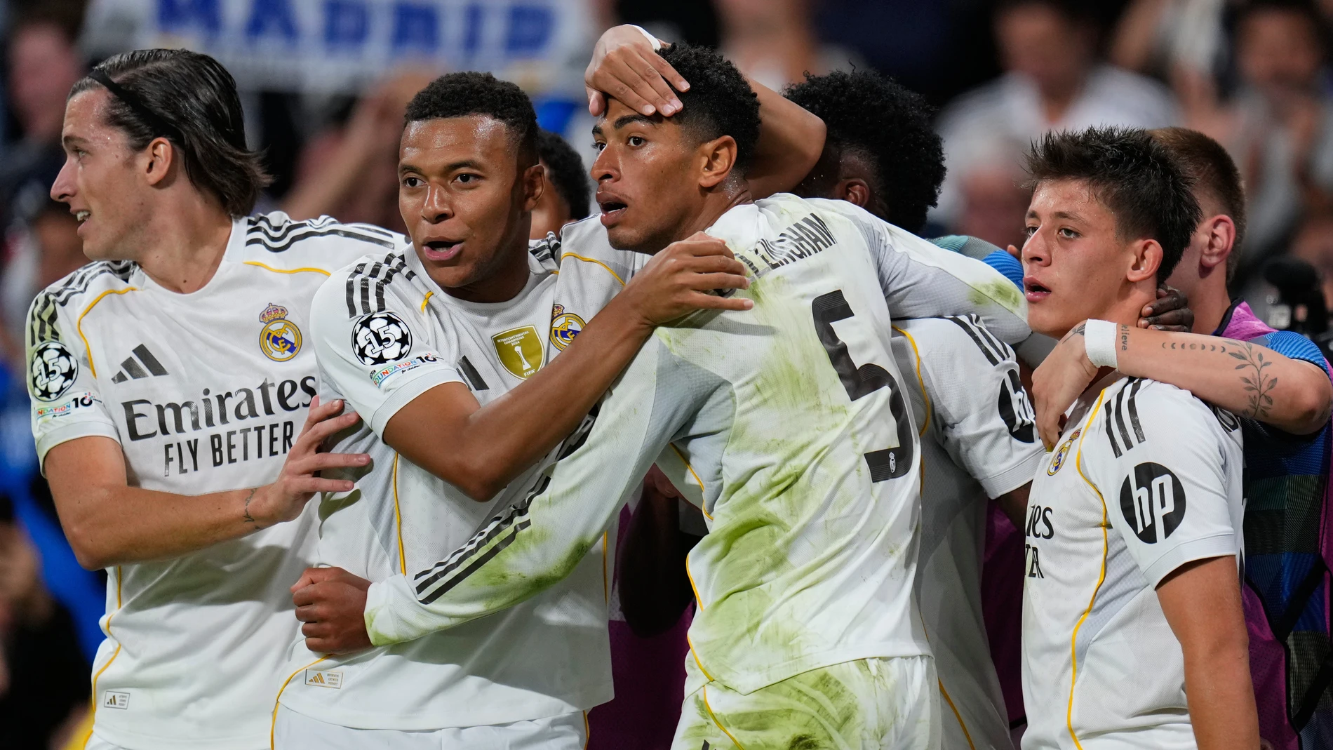 Real Madrid's Jude Bellingham celebrates with teammates after scoring his sides first goal during the Champions League opening phase soccer match between Real Madrid and Juventus in Madrid, Spain, Wednesday, Oct. 22, 2025. (AP Photo/Manu Fernandez)