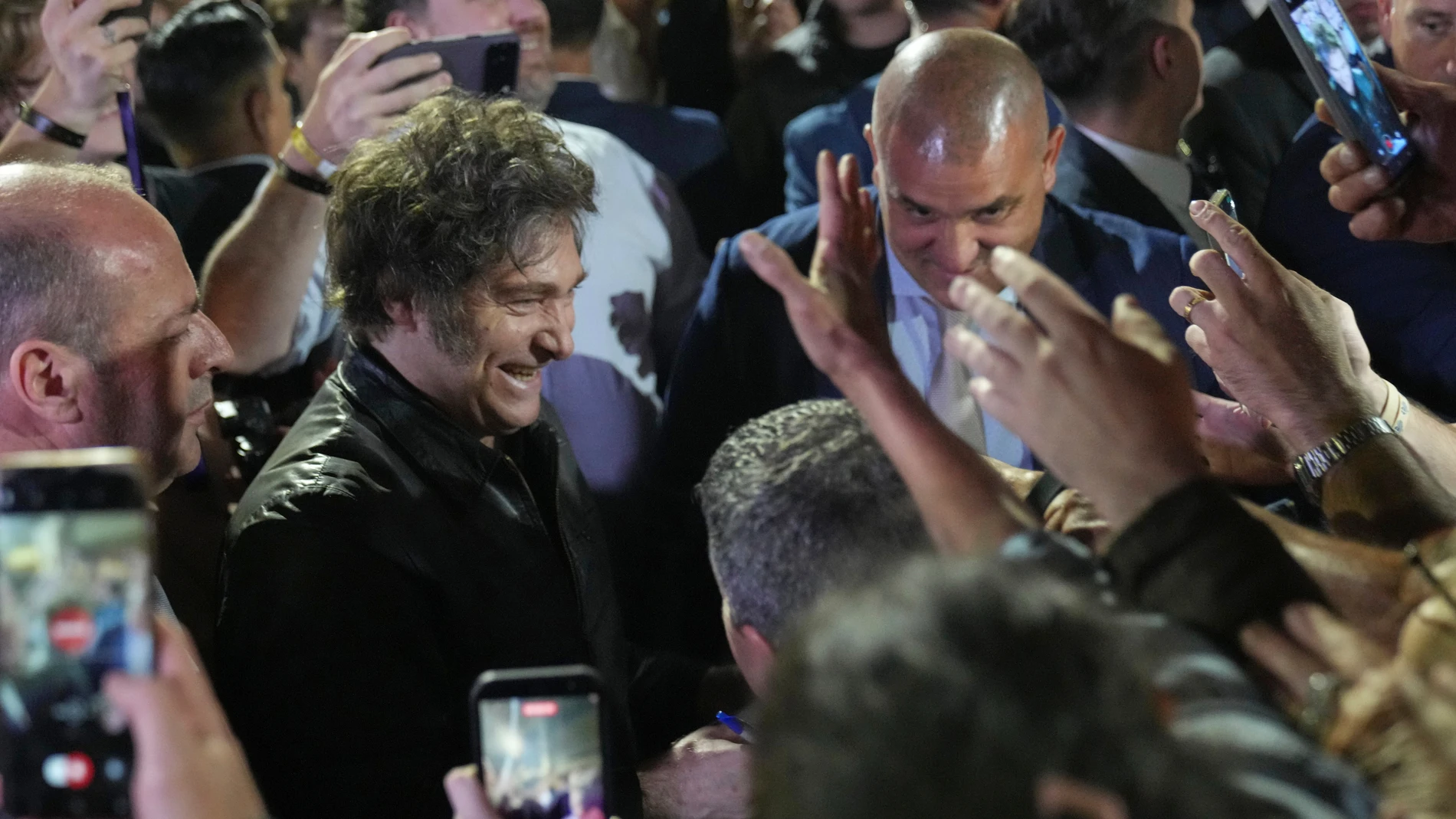 Argentina's President Javier Milei smiles to supporters after winning in legislative midterm elections in Buenos Aires, Argentina, Sunday, Oct. 26, 2025. (AP Photo/Rodrigo Abd)