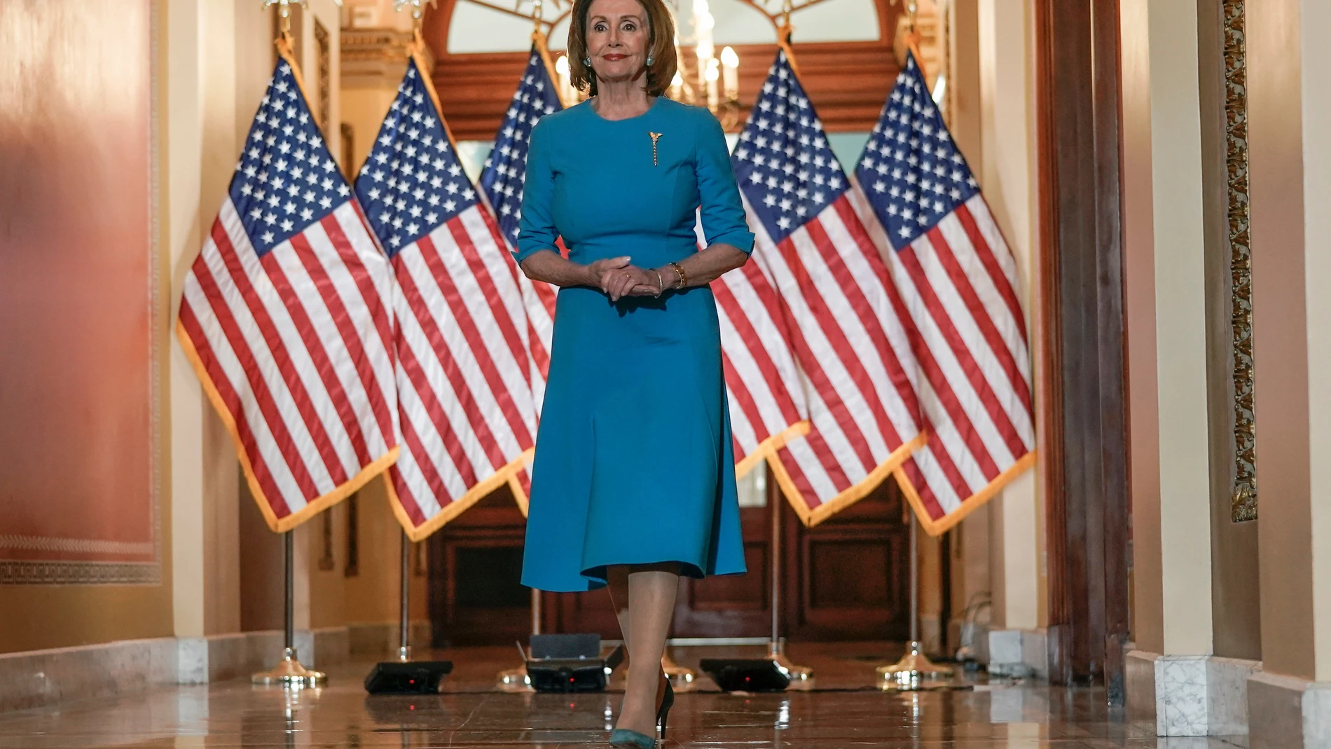 FILE - House Speaker Nancy Pelosi of Calif., arrives to speak about the House coronavirus bill on Capitol Hill in Washington, March, 13, 2020. (AP Photo/Scott Applewhite, File)