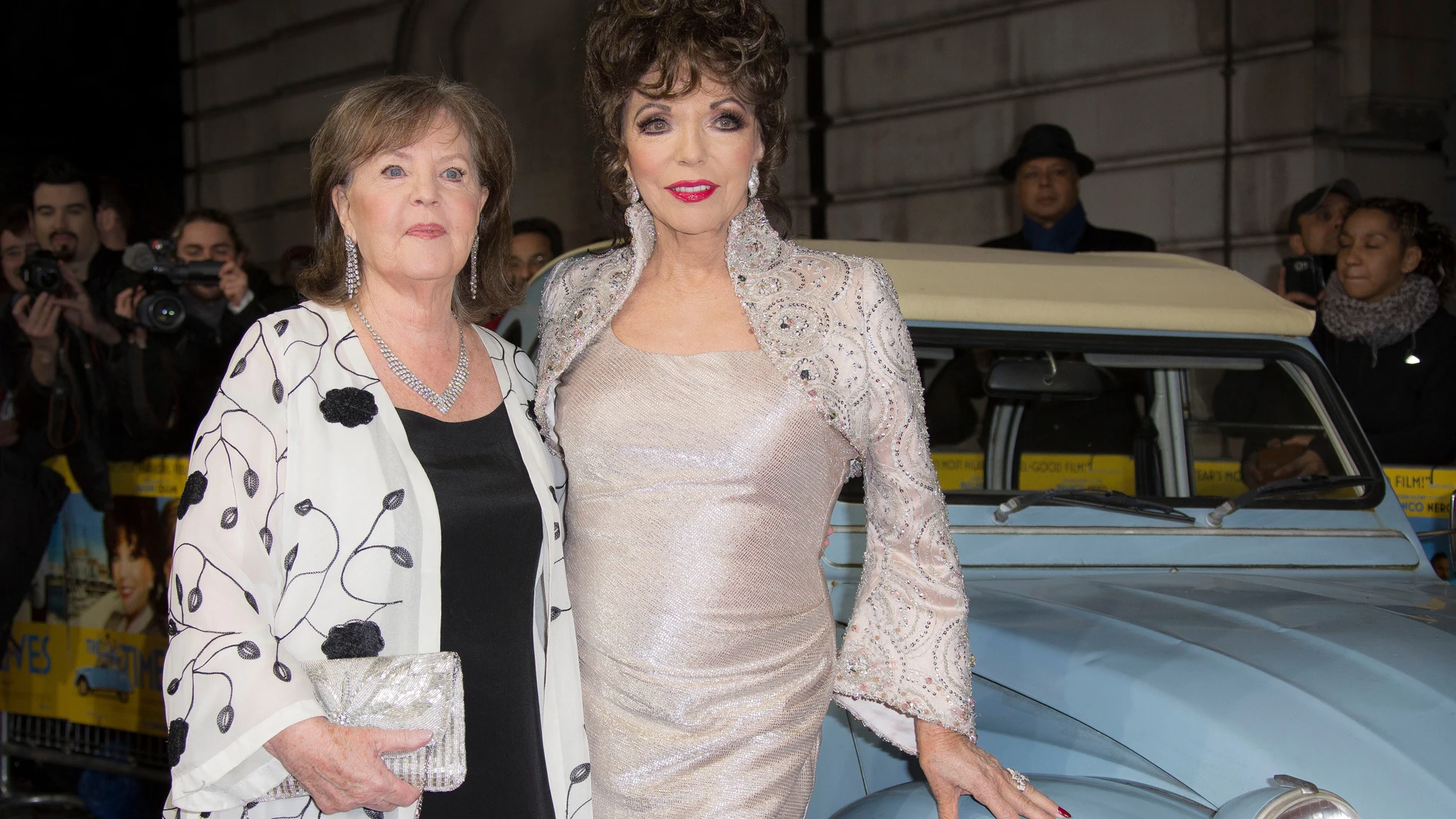 FILE - Actors Pauline Collins, left, and Joan Collins pose for photographers on the red carpet during the UK premiere for the film 'The Time of Their Lives' at a central London cinema, March 8, 2016. (Photo by Joel Ryan/Invision/AP, File)