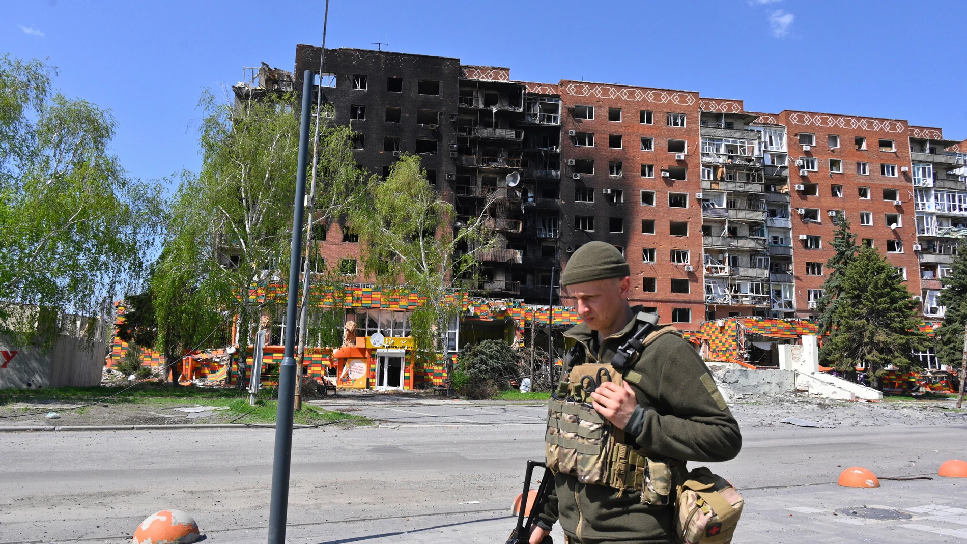 FILE - A Ukrainian soldier walks past damaged buildings in central Pokrovsk, the site of the heaviest battles with the Russian troops in the Donetsk region of Ukraine, April 23, 2025. (AP Photo/Michael Shtekel, File)
