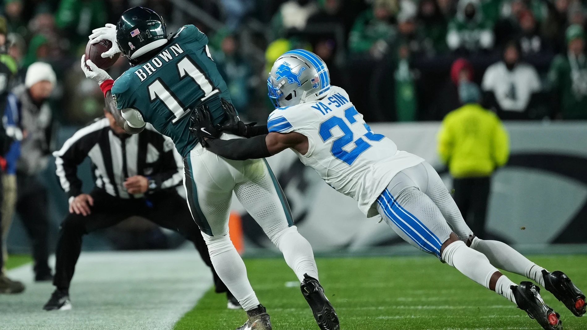 Philadelphia Eagles wide receiver A.J. Brown (11) makes a catch against Detroit Lions cornerback Rock Ya-Sin (23) during the second half of an NFL football game Sunday, Nov. 16, 2025, in Philadelphia. (AP Photo/Matt Slocum)