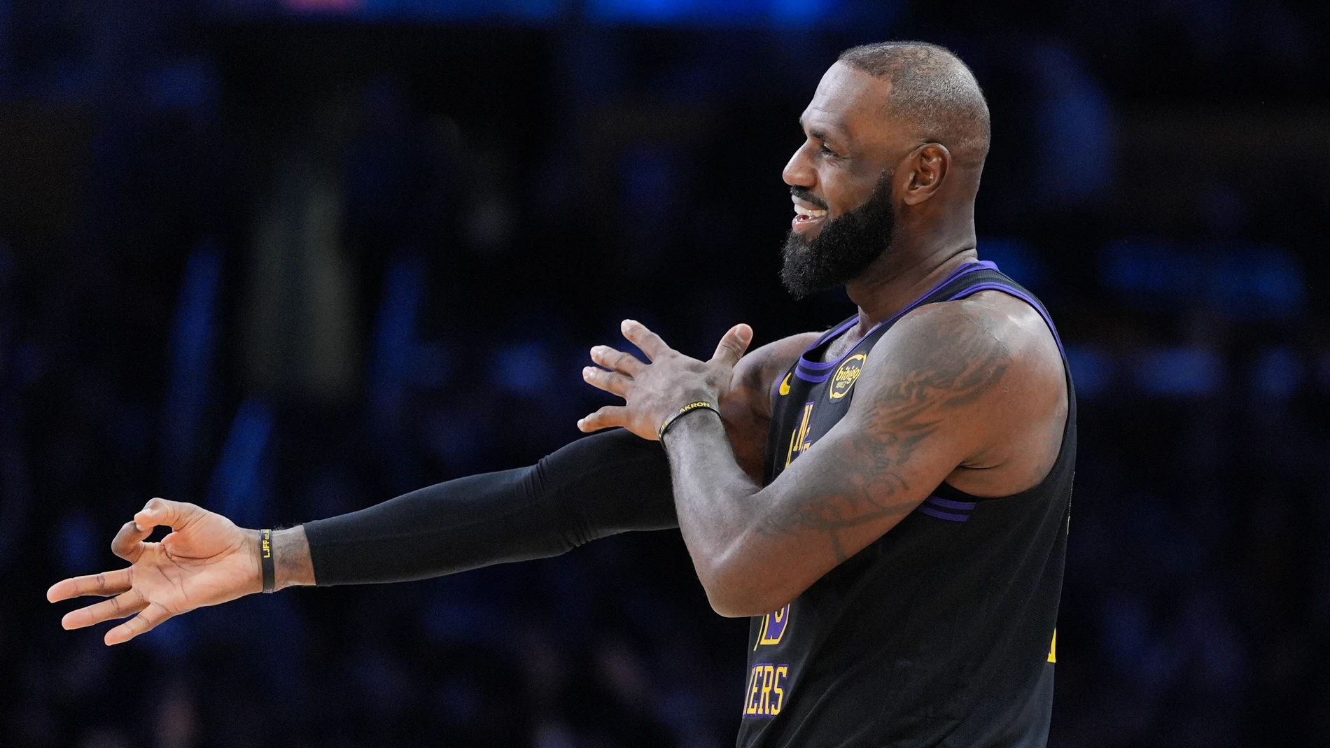 Los Angeles Lakers forward LeBron James (23) reacts to a three-point basket by guard Gabe Vincent during the second half of an NBA basketball game against the Utah Jazz Tuesday, Nov. 18, 2025, in Los Angeles. (AP Photo/Jae C. Hong)
