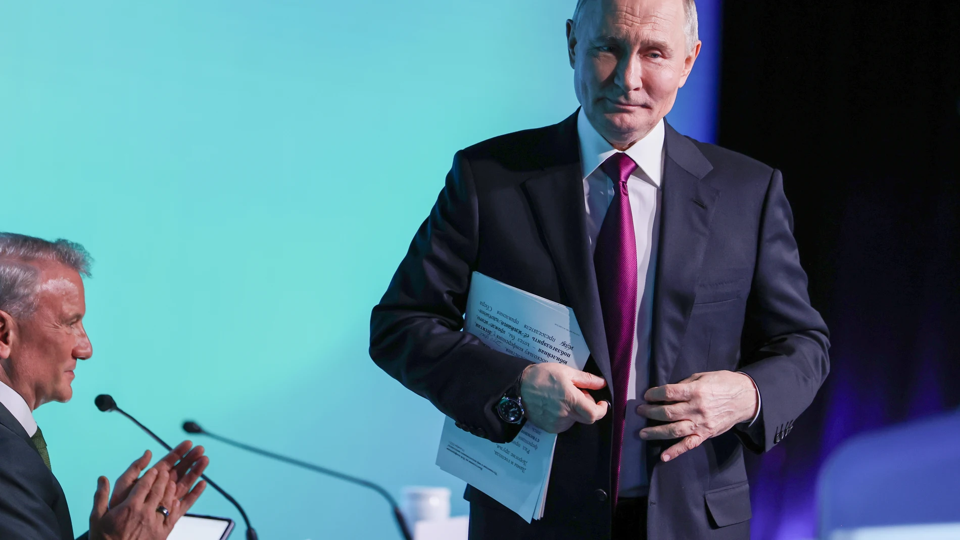 Russian President Vladimir Putin, right, and Sberbank CEO German Gref attend the plenary session "Future with AI" of the AI Journey 2025, an international conference on artificial intelligence and machine learning, at the Sberbank City business complex in Moscow, on Wednesday, Nov. 19, 2025. (Vyacheslav Prokofyev, Sputnik, Kremlin Pool Photo via AP)