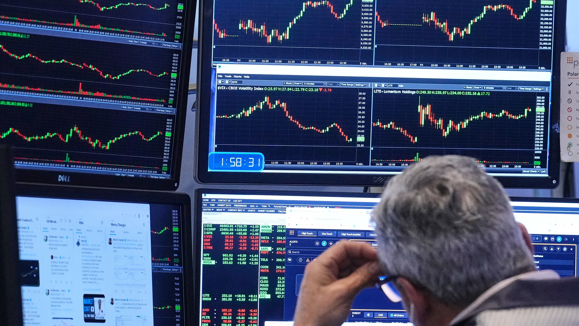 A trader works on the floor of the New York Stock Exchange, Friday, Nov. 21, 2025. (AP Photo/Richard Drew)