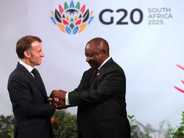 South Africa G20 South African Cyril Ramaphosa, right, welcomes French President Emmanuel Macron on the opening day of the G20 Summit, in Johannesburg, South Africa, Saturday, Nov. 22, 2025. (Halden Krog/Pool Photo via AP)