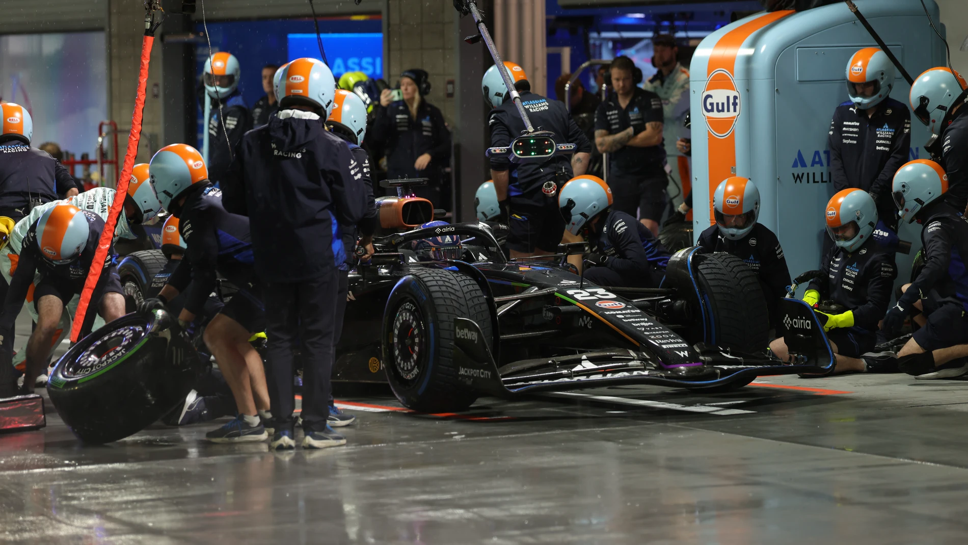 Crews work on the car of Williams driver Alexander Albon of Thailand during a qualifying session at the Formula One Las Vegas Grand Prix Auto Race, Friday, Nov. 21, 2025 in Las Vegas. (Cristobal Herrera Ulashkevich/Pool Photo via AP)