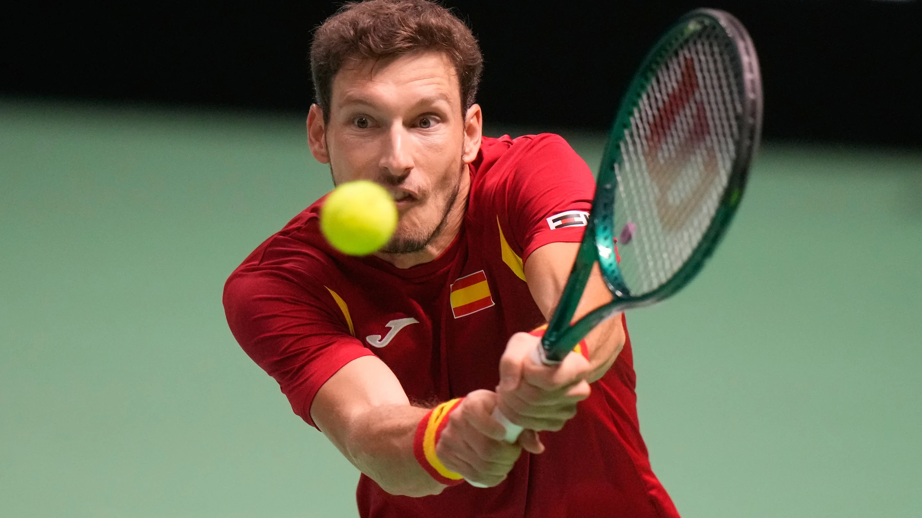 Spain's Pablo Carreno Busta returns the ball to Germany's Jan Lennard Struff during a Davis Cup singles semifinal tennis match between Spain and Germany, in Bologna, Italy, Saturday, Nov. 22, 2025. (AP Photo/Luca Bruno)
