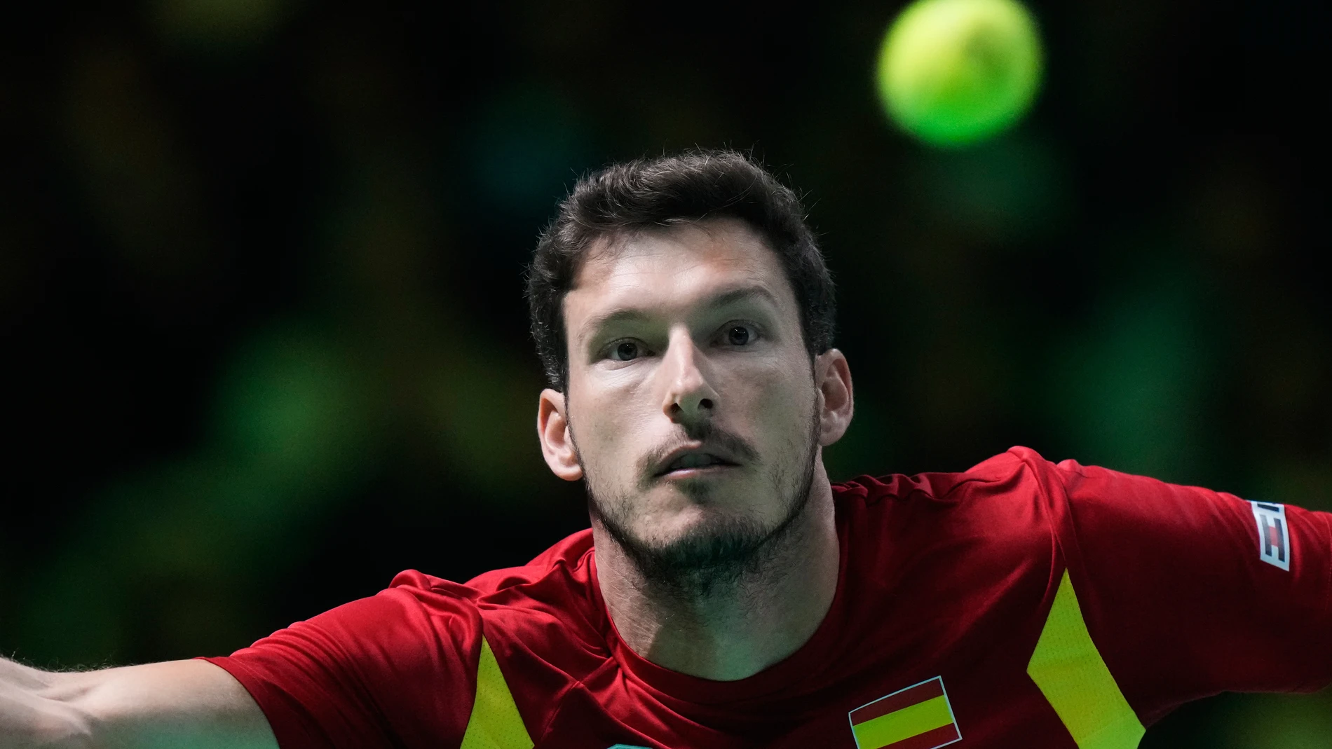 Spain's Pablo Carreno Busta returns a ball to Italy's Matteo Berrettini during a Davis Cup final singles tennis match between Italy and Spain, in Bologna, Italy, Sunday, Nov. 23, 2025. (AP Photo/Luca Bruno)