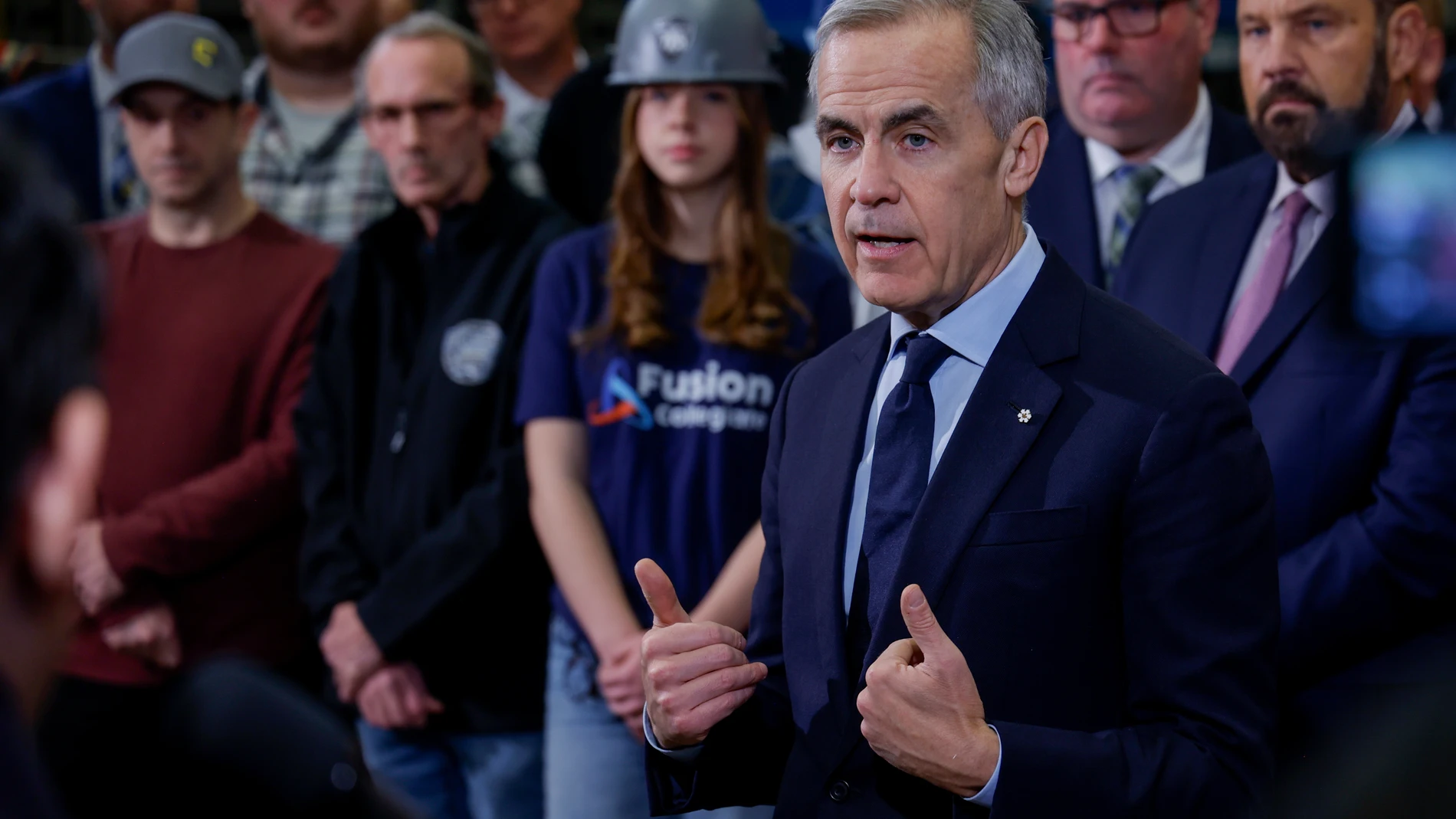 Prime Minister Mark Carney meets with ironworkers in Calgary, Alta., Thursday, Nov. 27, 2025. (Jeff McIntosh /The Canadian Press via AP)