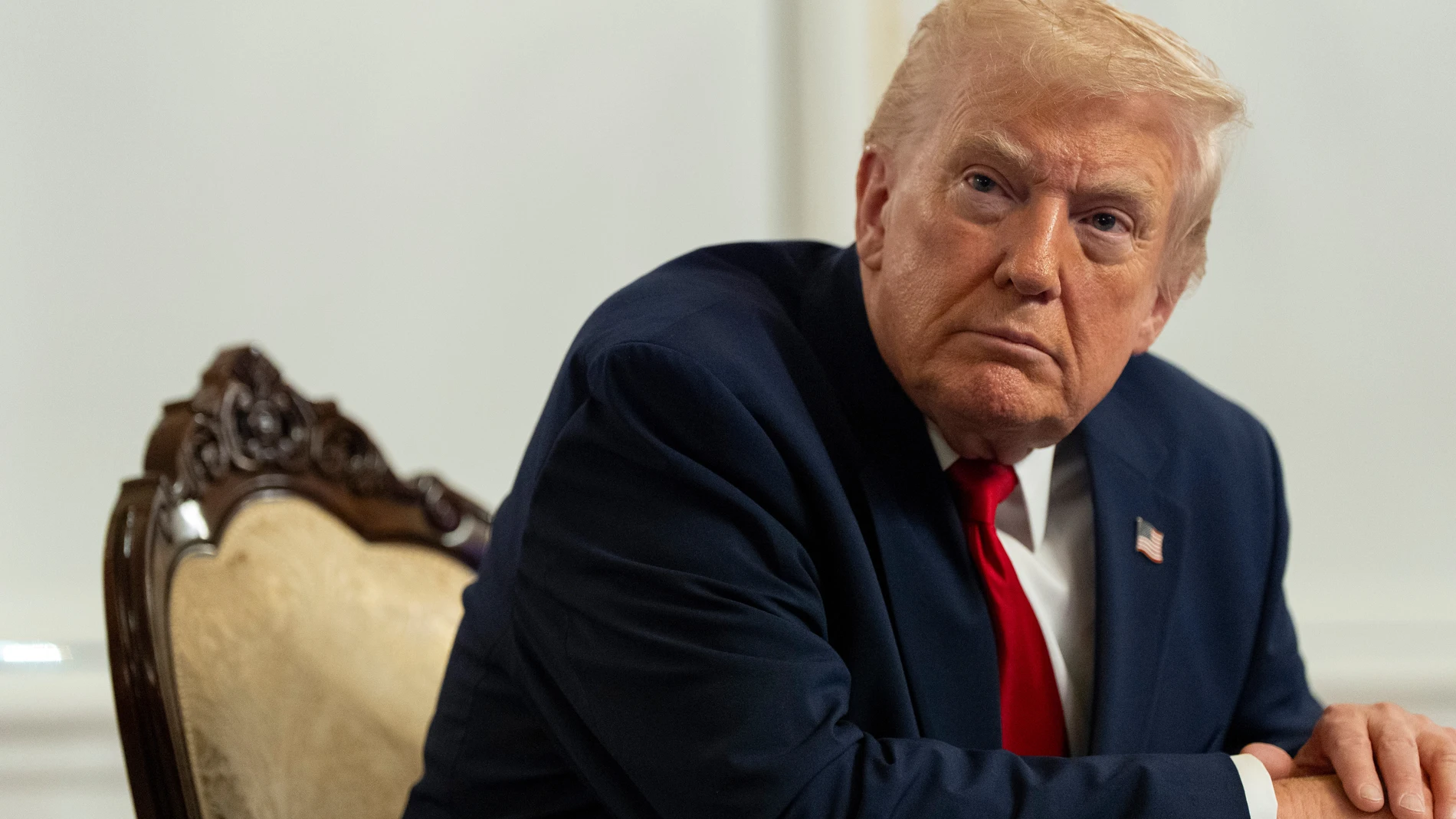 President Donald Trump speaks to reporters after speaking to troops via video from his Mar-a-Lago estate on Thanksgiving, Thursday, Nov. 27, 2025, in Palm Beach, Fla. (AP Photo/Alex Brandon)