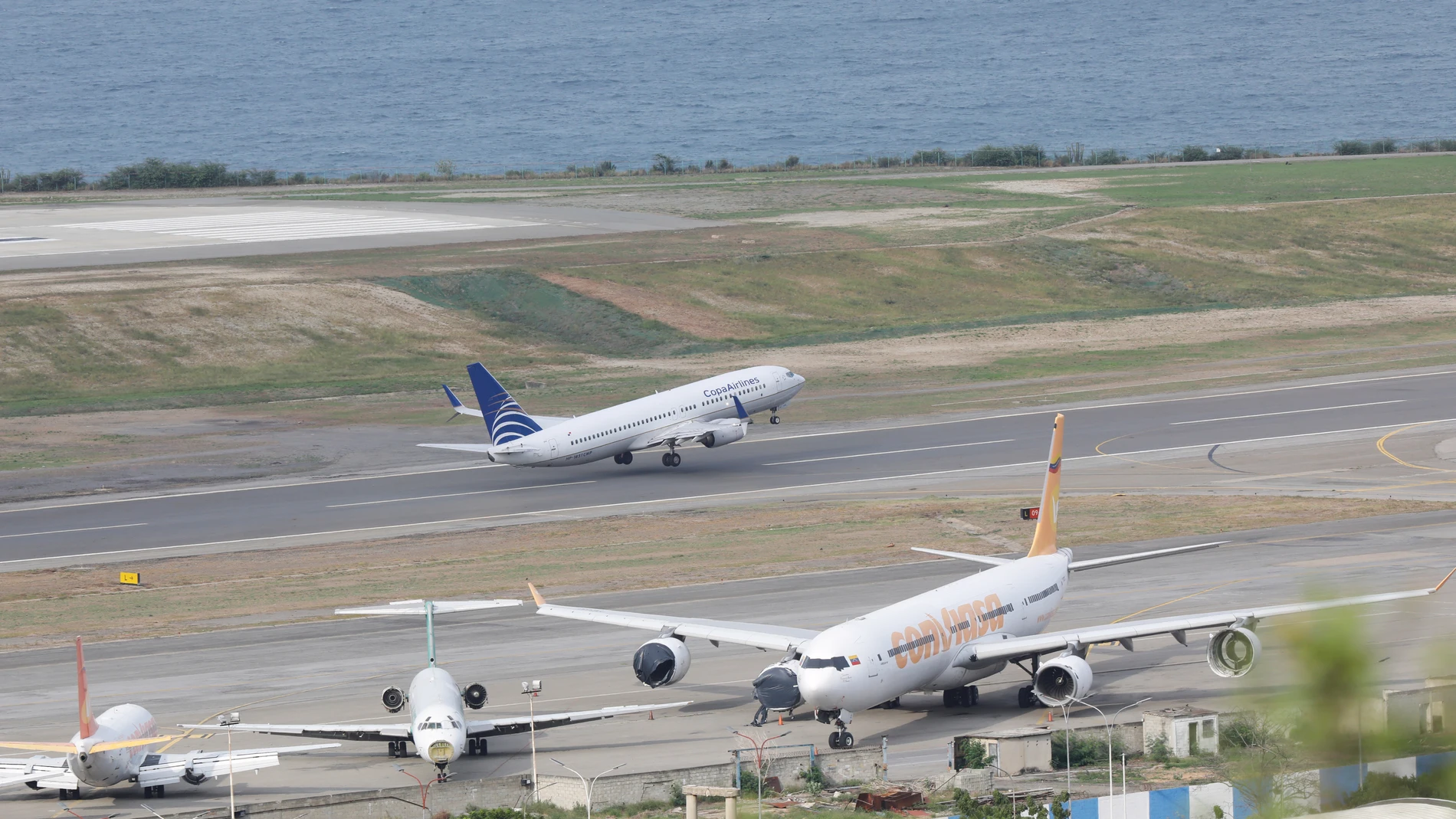A COPA Airlines plane takes off at Simon Bolivar International Airport in Maiquetia, Venezuela, Monday, Dec. 1, 2025, days after the government revoked operating rights for international airlines that suspended flights following a warning from the U.S. Federal Aviation Administration.(AP Photo/Cristian Hernandez)