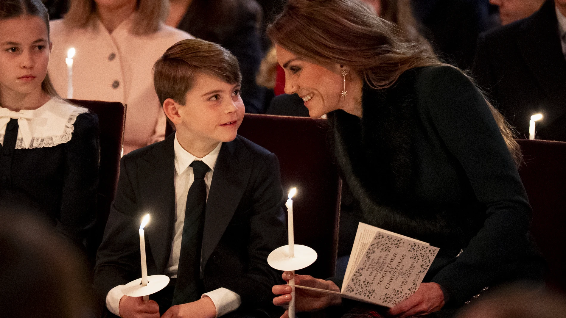 Britain's Kate, Princess of Wales, right, Princess Charlotte, left, and Prince Louis attend the "Together At Christmas" carol service at Westminster Abbey, in London, Friday, Dec. 5, 2025. (Aaron Chown/Pool Photo via AP)