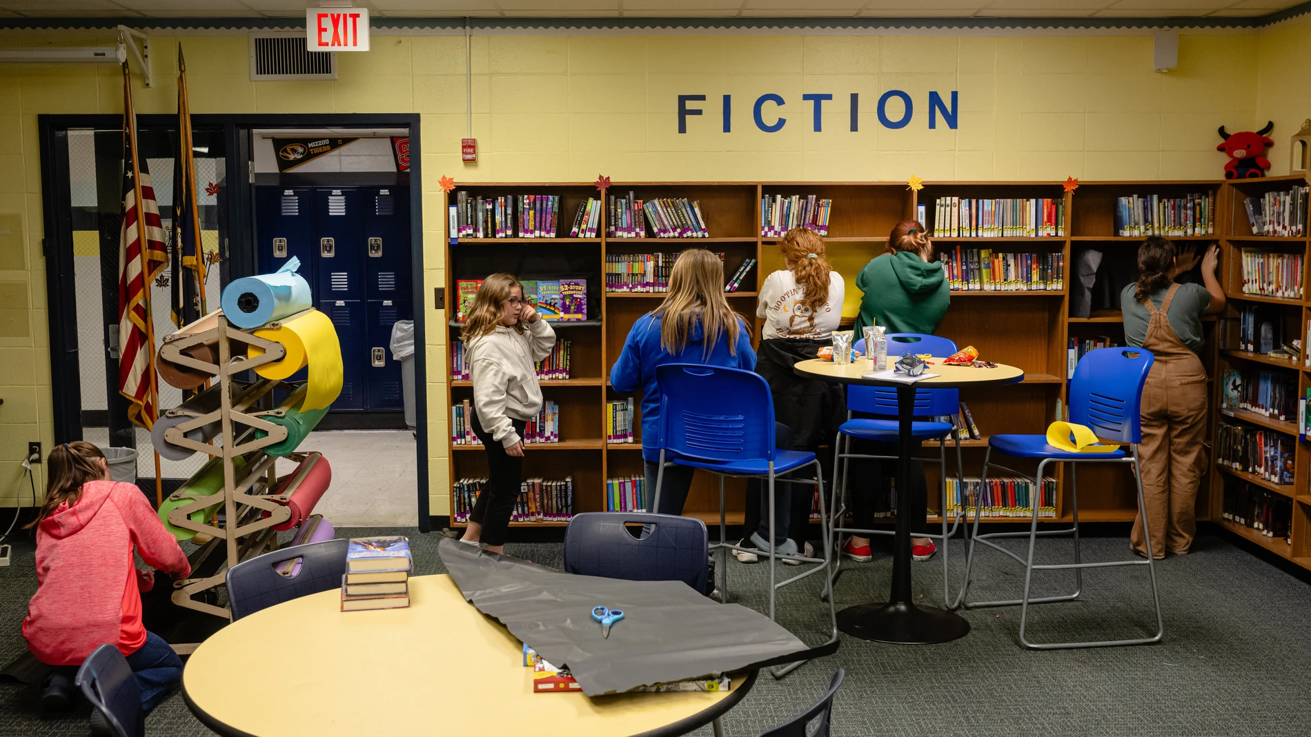Students organize and decorate the library after school at East Middle School, Nov. 17, 2025, in Shelbyville, Ky. (AP Photo/Jon Cherry)