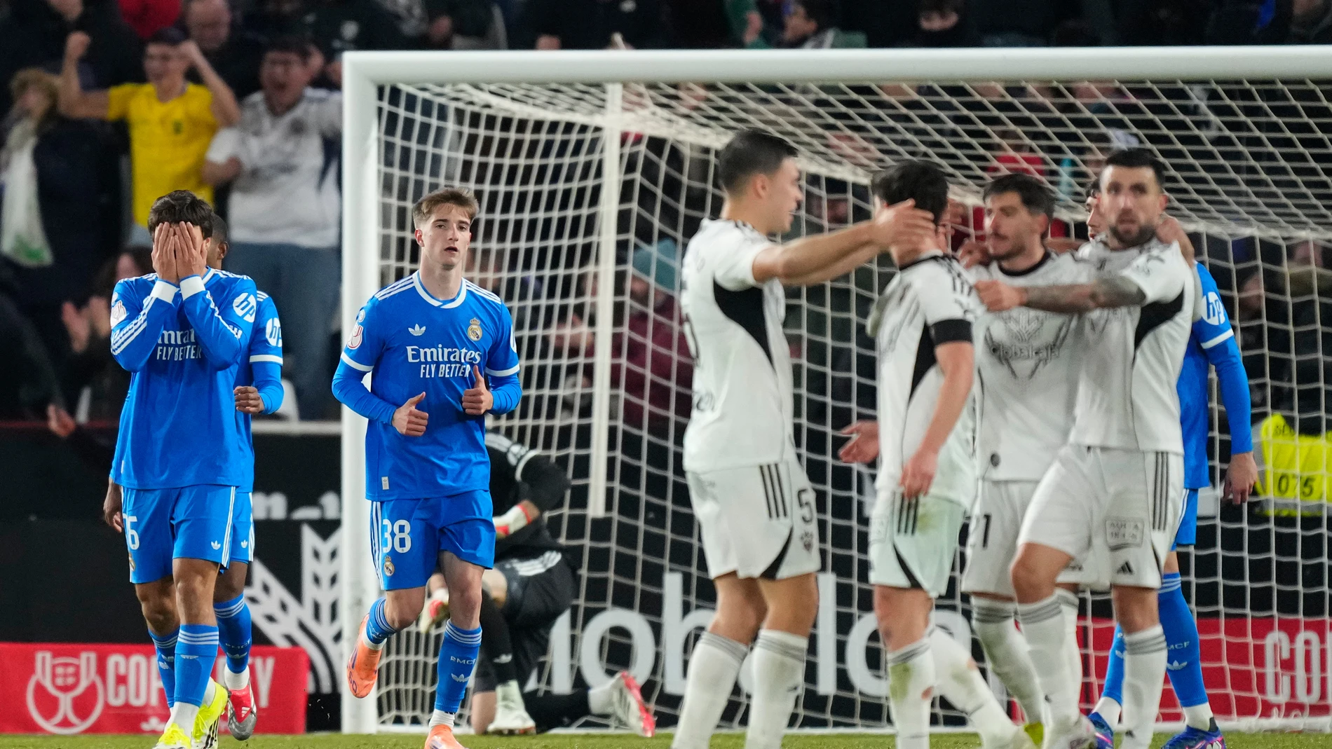 Real Madrid players react after Albacete scored its second goal during the Copa del Rey round of 16 soccer match between Albacete and Real Madrid, in Albacete, Spain, Wednesday, Jan. 14, 2026. (AP Photo/Jose Breton)