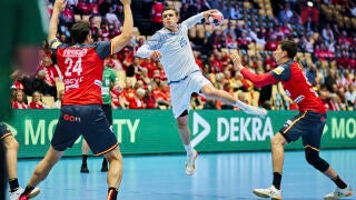 Portugal's Francisco Costa in a duel with Spain's Daniel Dujshebaev, left, in action during the men's handball match between Spain and Portugal in Herning, Denmark, Wednesday Jan. 28, 2026. (Thomas Traasdahl/Ritzau Scanpix via AP)