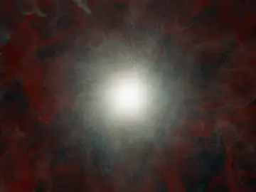 Una ilustración de una estrella que colapsó, formando un agujero negro. El agujero negro está en el centro, invisible. A su alrededor hay una capa de polvo que se aleja del agujero negro y gas que es atraído hacia él. Una ilustración de una estrella que colapsó, formando un agujero negro. El agujero negro está en el centro, invisible. A su alrededor hay una capa de polvo que se aleja del agujero negro y gas que es atraído hacia él.