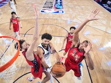 NBA All-Star Game Basketball World guard Jamal Murray, of Canada, center drives to the basket against USA Stars in the NBA All-Star basketball game Sunday, Feb. 15, 2026, in Inglewood, Calif. (Ronald Martinez/Pool Photo via AP)
