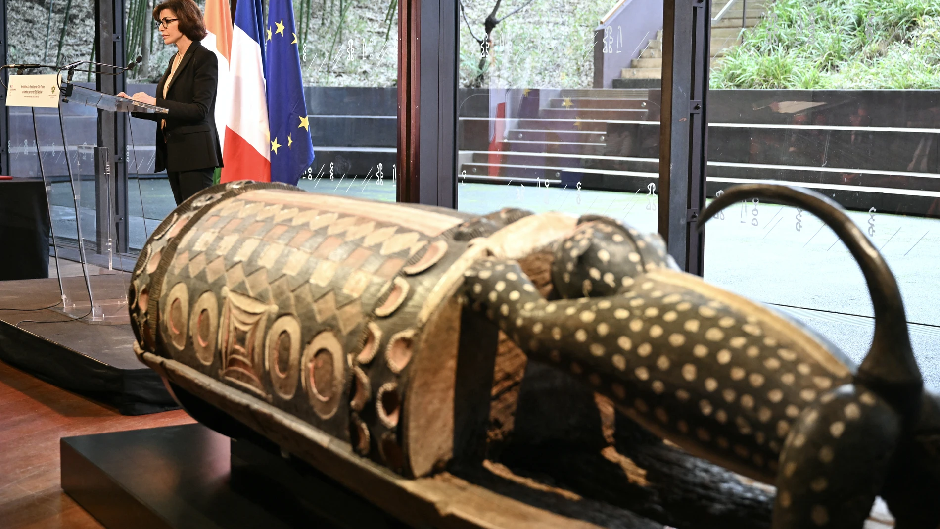 France's Culture Minister Rachida Dati addresses the audience during a ceremony for the official restitution to the Republic of Cote d'Ivoire of the sacred talking drum Djidji Ayokwe, confiscated in 1916 by French colonial authorities from the Ebrie people, at the Musee du Quai Branly in Paris on February 20, 2026.