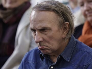French writer Michel Houellebecq looks on as he attends a meeting on euthanasia organised by the association "Les Eligibles et leurs Aidants" as French National Assembly debate