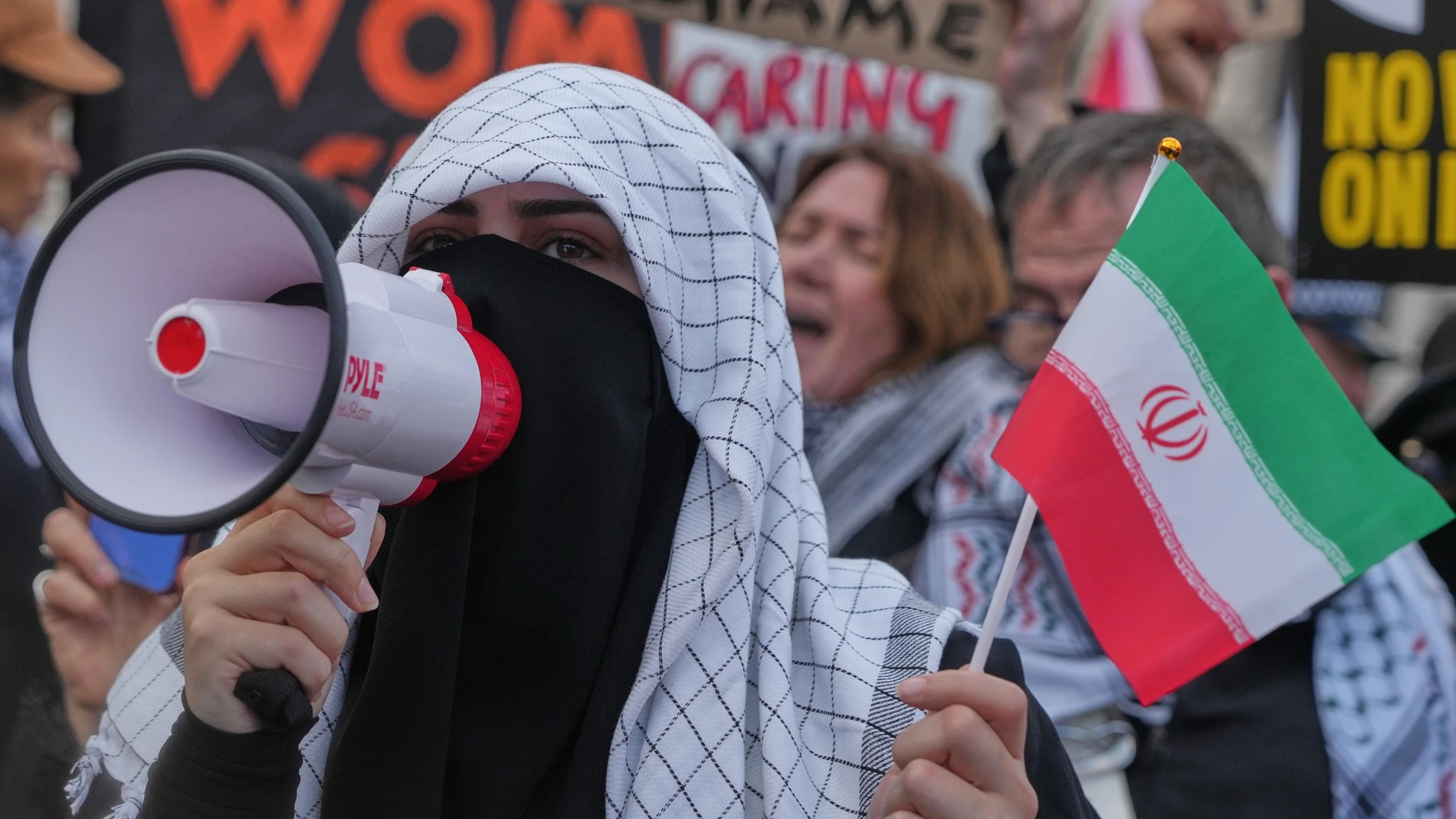 Protesters gather in London, Saturday, Feb. 28, 2026 after U.S. and Israeli forces carried out a series of strikes on Iran on Saturday morning. (AP Photo/Alastair Grant)
