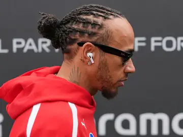 Australia F1 GP Auto Racing Ferrari driver Lewis Hamilton of Britain arrives ahead of the first practice session for the Australian Formula One Grand Prix at Albert Park, in Melbourne, Australia, Friday, March 6, 2026. (AP Photo/Asanka Brendon Ratnayake)
