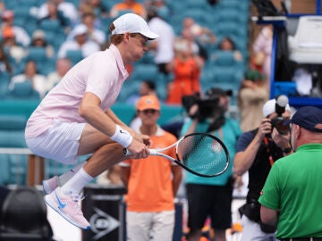 Jannik Sinner of Italy jumps in the air as he warms up at the start of his men's singles final against Jiri Lehecka of the Czech Republic, at the Miami Open tennis tournament, Sunday, March 29, 2026, in Miami Gardens, Fla. (AP Photo/Rebecca Blackwell)