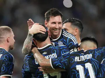 Argentina Zambia WCup Soccer Argentina's Lionel Messi greets teammates Nicolas Otamendi after he scored the third goal against Zambia during a friendly soccer match in Buenos AIres, Argentina, Tuesday, March 31, 2026. (AP Photo/Gustavo Garello)