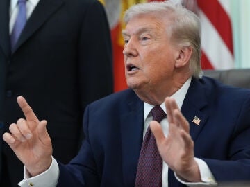 President Donald Trump answers questions from reporters after signing an executive order in the Oval Office of the White House Tuesday, March 31, 2026, in Washington. (AP Photo/Alex Brandon)