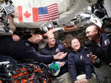 In this image from video provided by NASA, Artemis II astronauts, from left, Reid Wiseman, Jeremy Hansen, Christina Koch and Victor Glover gather for an interview en route to the moon on Saturday, April 4, 2026. (NASA via AP)