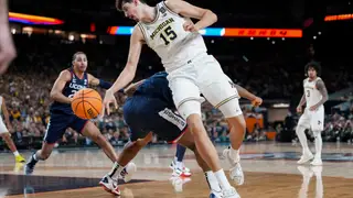 NCAA UConn Michigan Basketball Michigan center Aday Mara (15) spins towards the basket during the second half of the NCAA college basketball tournament national championship game against UConn at the Final Four, Monday, April 6, 2026, in Indianapolis. (AP Photo/Abbie Parr)